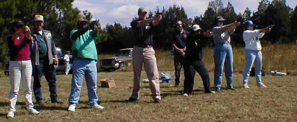 Instructos carefully observe the students during firing.