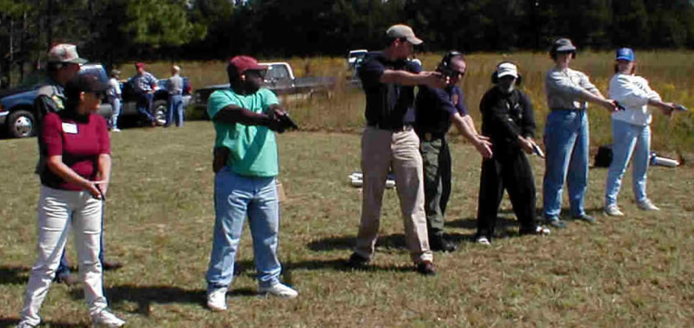 CWP Instructor demonstrating the safe-direction principle on the firing range